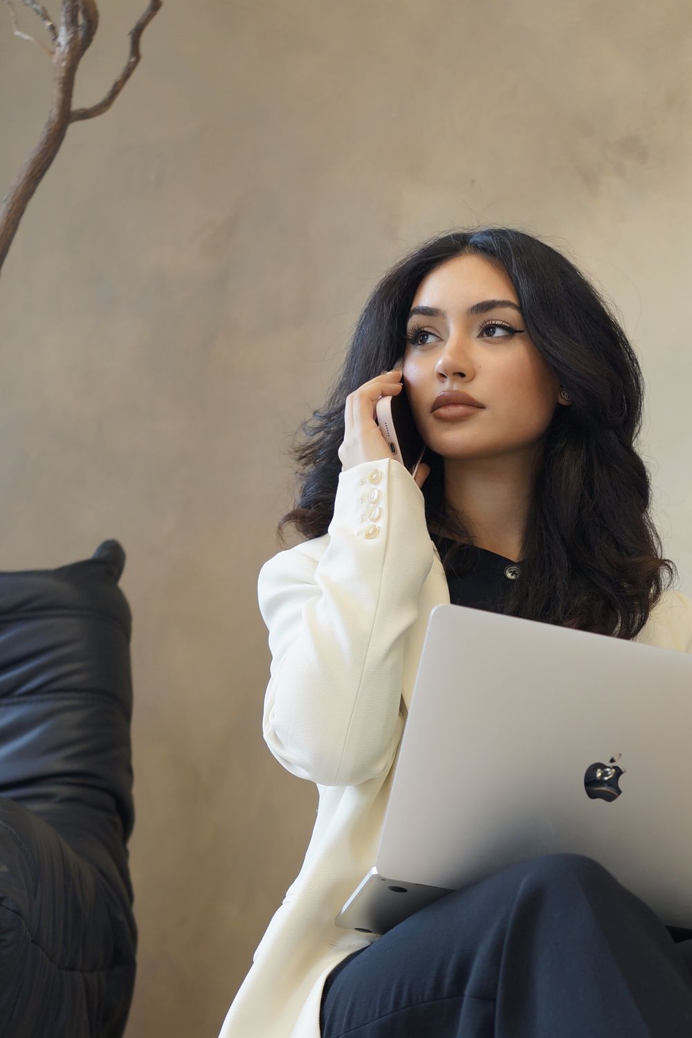 Helia on a call with her laptop open